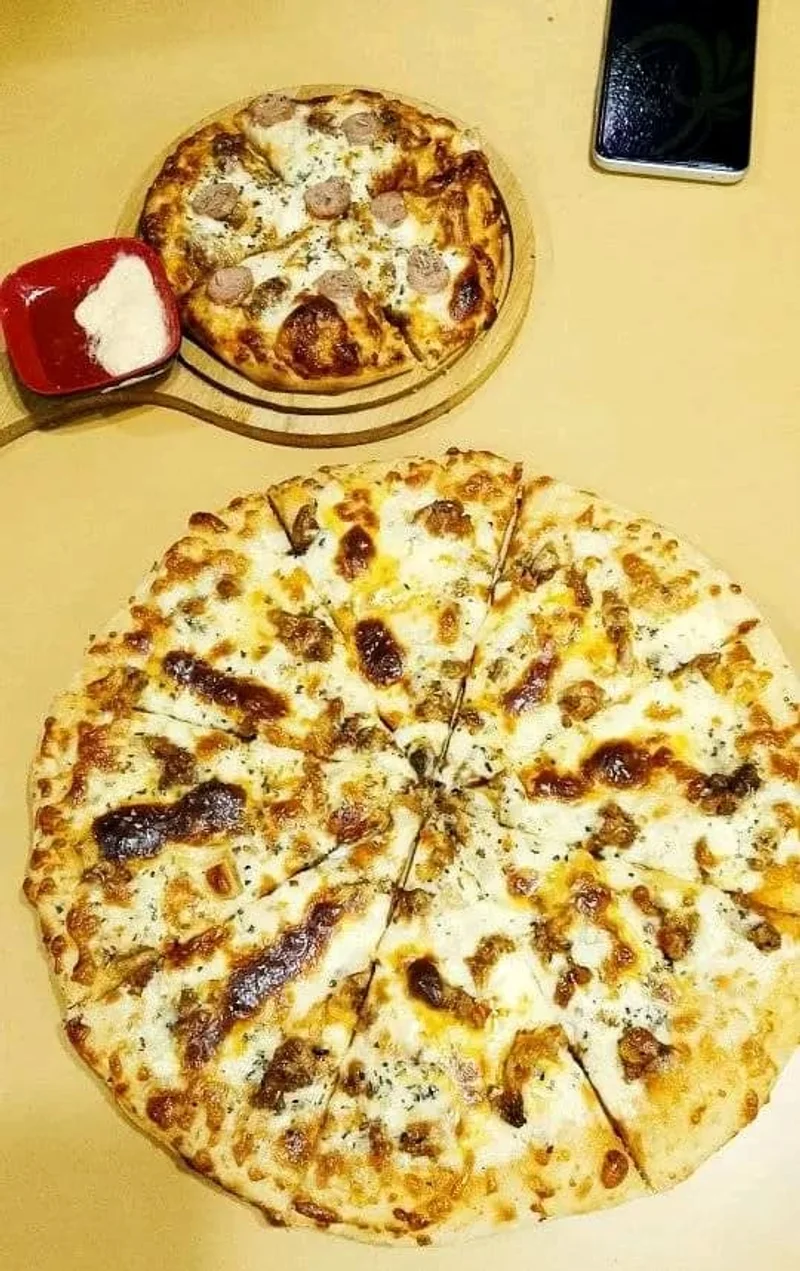 Buy One Pizza And Get One Pizza Plus Lemon Mint Free at Cafe Food Garden Mirpur