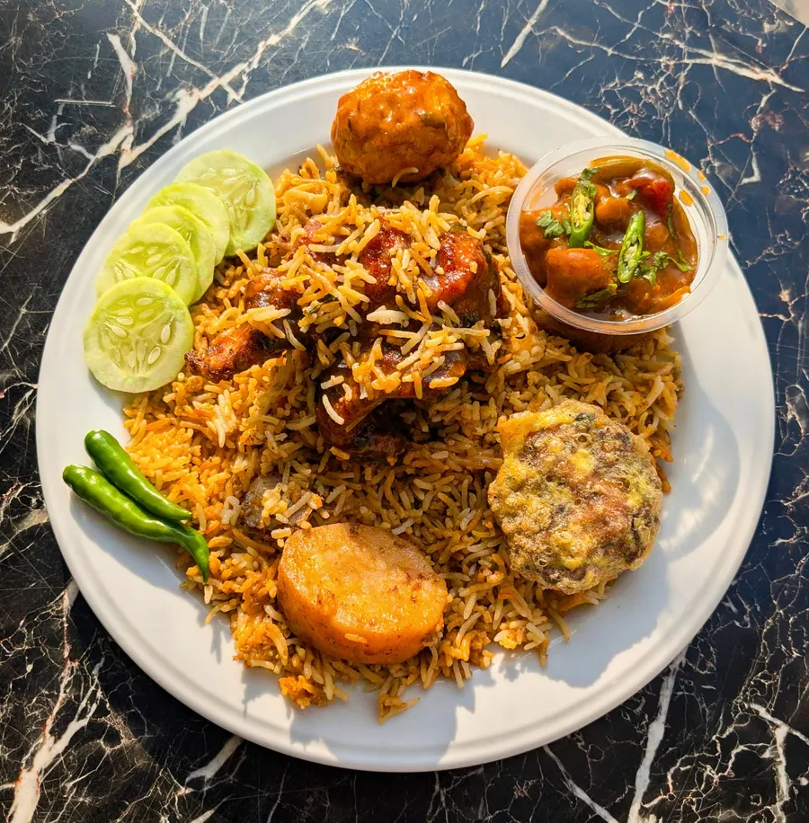 Dom biriyani and haydrabadi couple platter offer at Yummy Express  ·