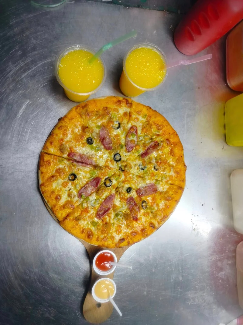 Buy Any Pizza And Get Mango Juice at FIRE CLUB PIZZA